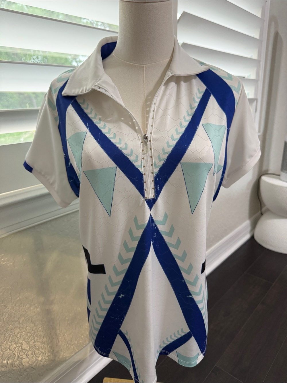 Women’s White Short Sleeve Golf Polo with Blue and Mint Geometric Design